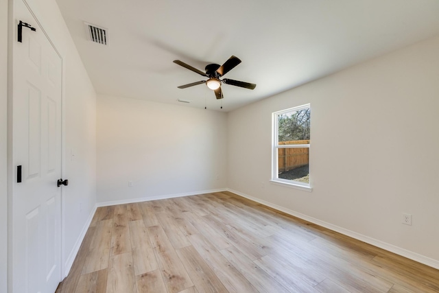 unfurnished room with ceiling fan and light wood-type flooring