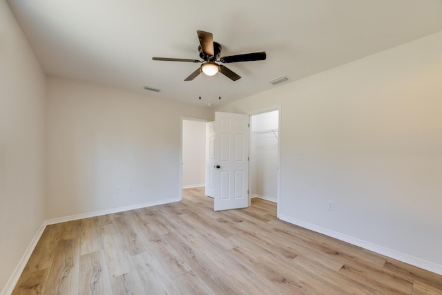 unfurnished room featuring ceiling fan and light wood-type flooring