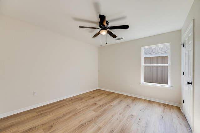 empty room featuring ceiling fan and light wood-type flooring