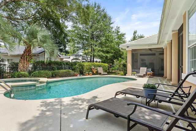 view of swimming pool featuring an in ground hot tub, ceiling fan, and a patio area