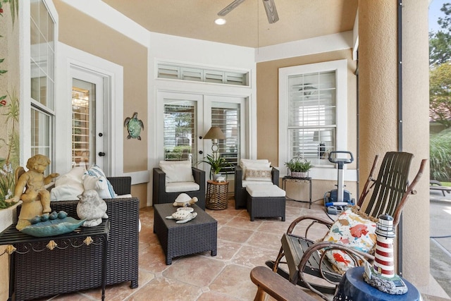 sunroom featuring ceiling fan