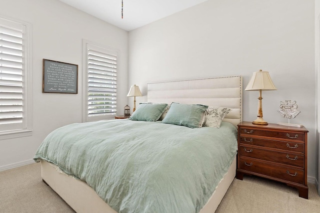 bedroom with light carpet