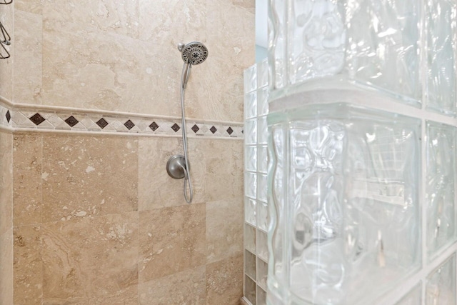 bathroom with tiled shower