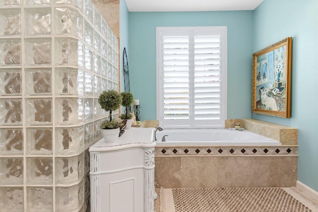 bathroom featuring a relaxing tiled tub and tile patterned floors