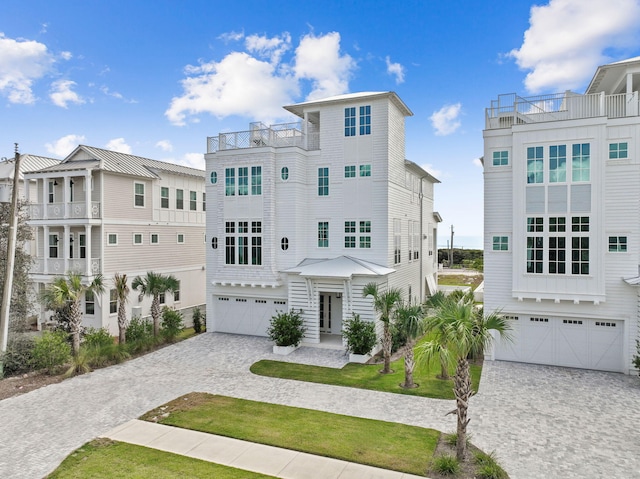 view of front of property featuring a garage and a front lawn