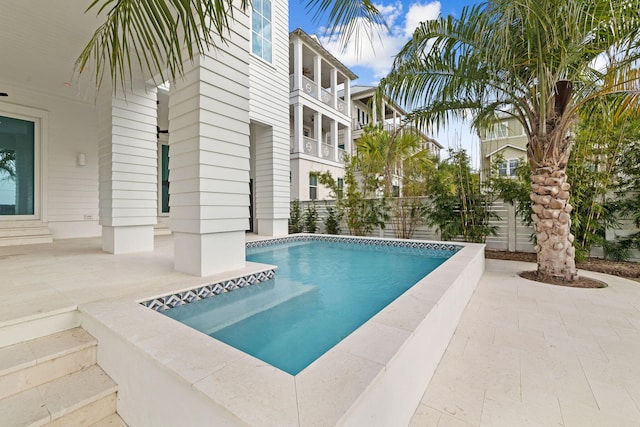 view of swimming pool with a patio