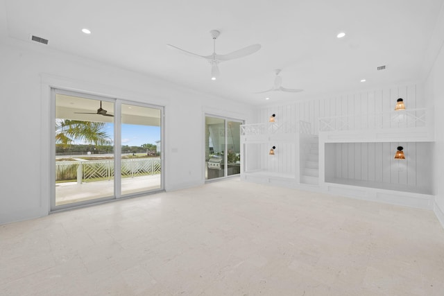 unfurnished living room with ceiling fan