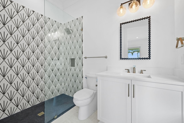 bathroom featuring walk in shower, tile patterned flooring, toilet, vanity, and tile walls