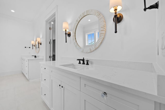 bathroom featuring vanity and ornamental molding