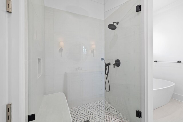 bathroom featuring plus walk in shower