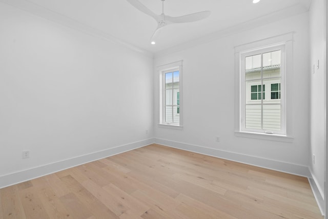 unfurnished room featuring light hardwood / wood-style floors, plenty of natural light, ornamental molding, and ceiling fan