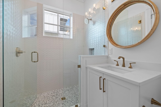 bathroom with vanity and an enclosed shower