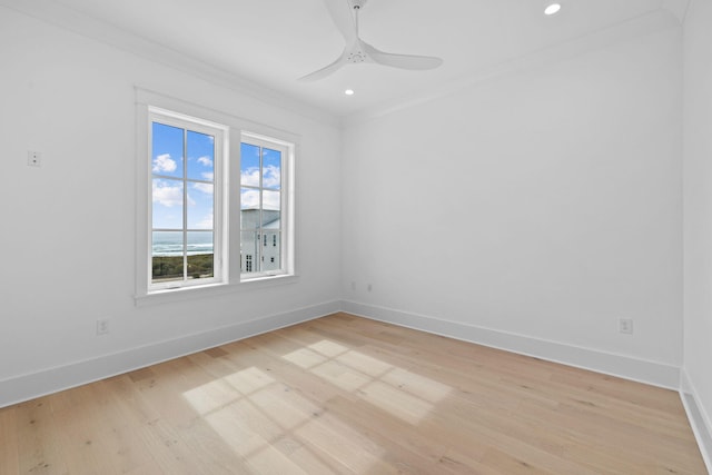 unfurnished room with ceiling fan, ornamental molding, and light wood-type flooring