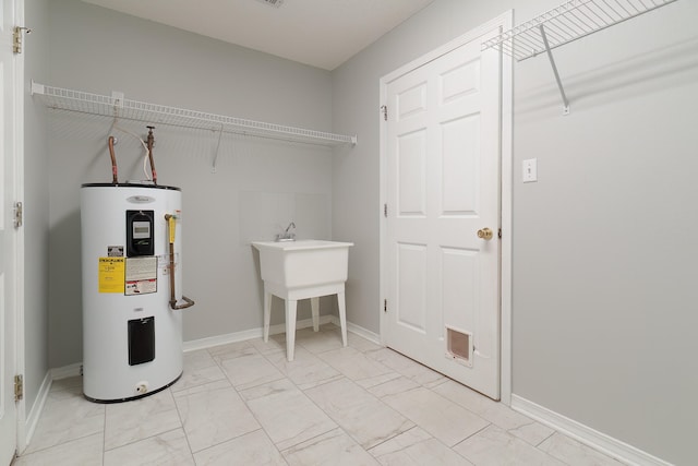 laundry area with electric water heater