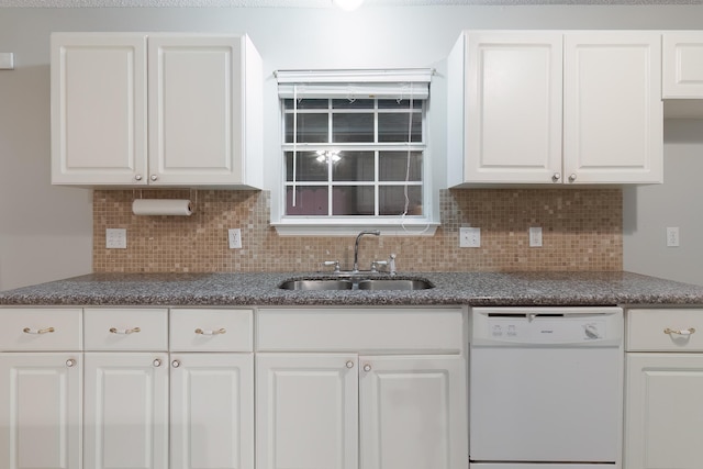 kitchen with dishwasher, decorative backsplash, white cabinetry, and sink