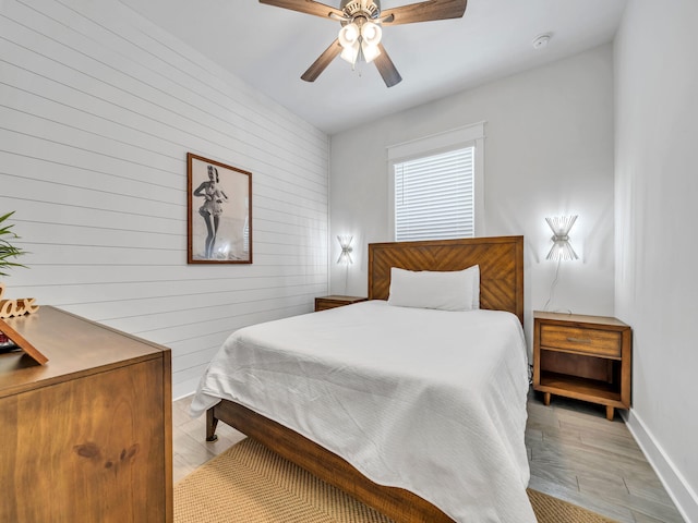 bedroom featuring ceiling fan and light hardwood / wood-style flooring