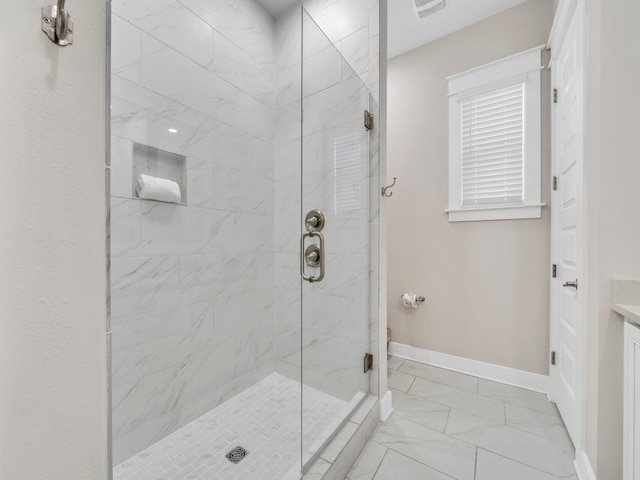 bathroom with vanity and a shower with shower door