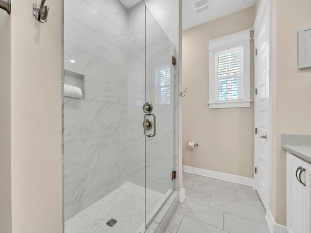 bathroom with vanity and walk in shower