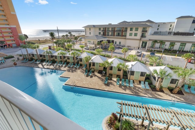 view of pool with a water view