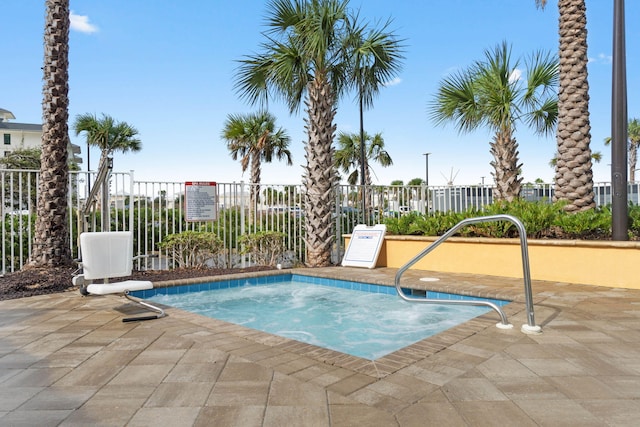 view of pool featuring a hot tub