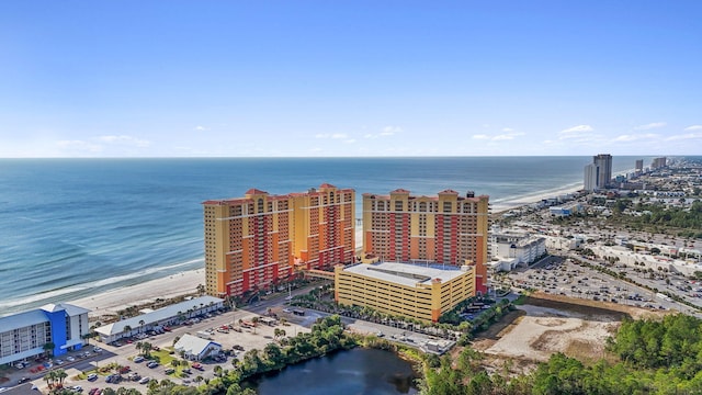 birds eye view of property featuring a view of the beach and a water view