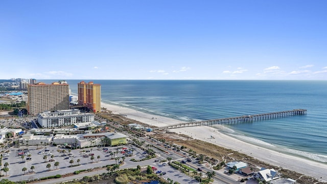 bird's eye view featuring a water view and a beach view