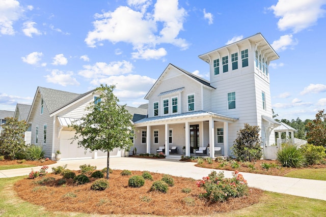 view of front of property featuring a porch and a garage