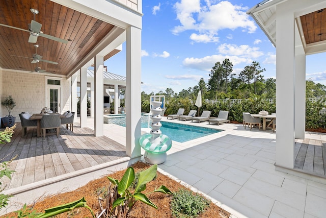 view of swimming pool with a patio area and ceiling fan