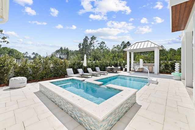 view of swimming pool with a gazebo, an in ground hot tub, and a patio area