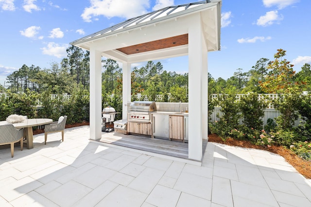 12 Needle Cast Ln, Inlet Beach, FL 32461 - fenced backyard with a patio, outdoor dining space, view of wooded area, and a sink