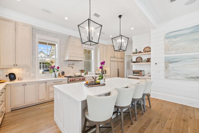 12 Needle Cast Ln, Inlet Beach, FL 32461 - kitchen with open shelves, high end stove, premium range hood, a chandelier, and light wood-style flooring