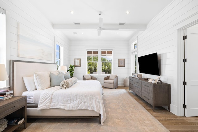 12 Needle Cast Ln, Inlet Beach, FL 32461 - bedroom with wood finished floors, beamed ceiling, wooden walls, ceiling fan, and crown molding