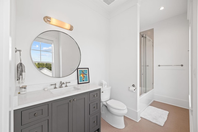 full bathroom with crown molding, toilet, vanity, and combined bath / shower with glass door