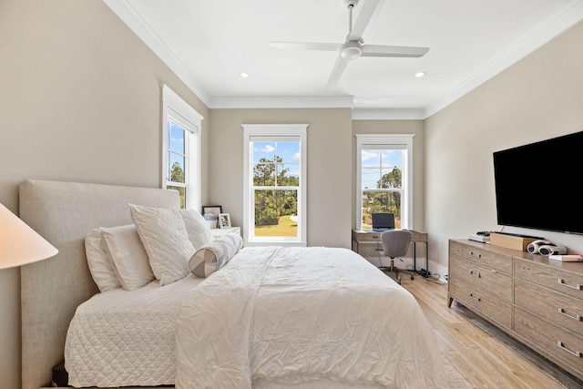 bedroom featuring ceiling fan, crown molding, and light wood-type flooring