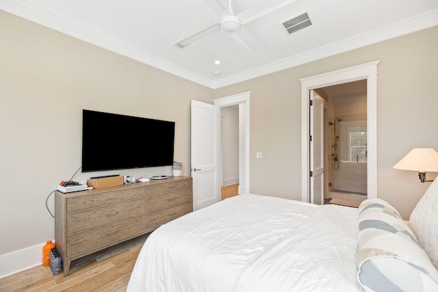 bedroom featuring wood-type flooring, ensuite bathroom, ceiling fan, and crown molding