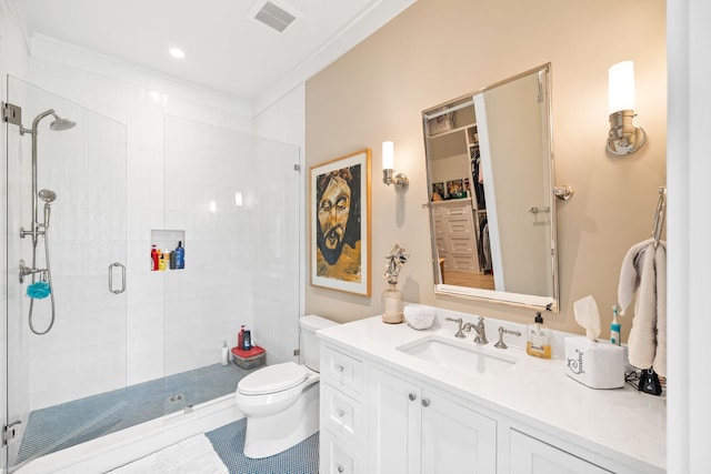 bathroom with tile patterned floors, walk in shower, ornamental molding, vanity, and toilet