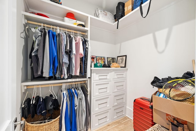 walk in closet featuring light hardwood / wood-style floors