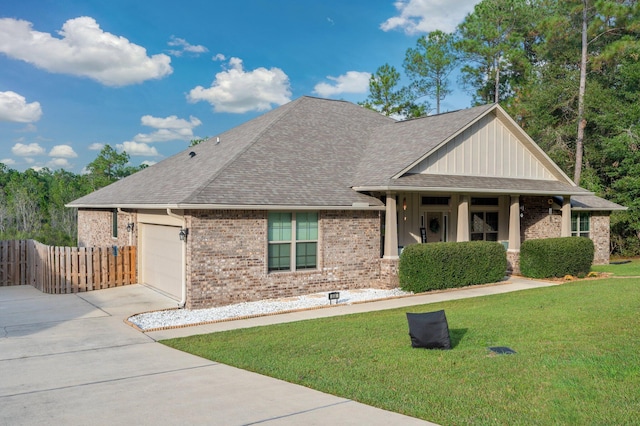 view of front of house featuring a front lawn and a garage