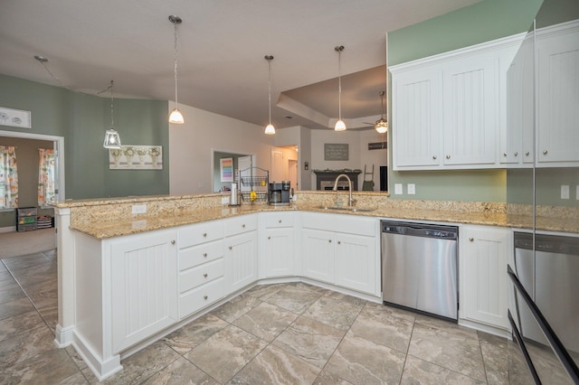 kitchen with dishwasher, white cabinetry, hanging light fixtures, and sink