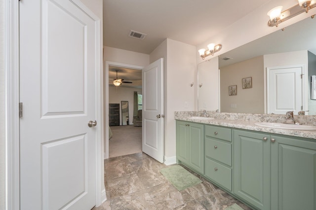 bathroom featuring ceiling fan and vanity