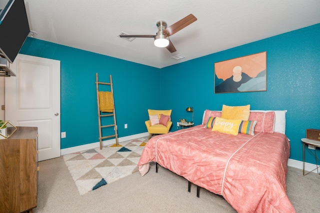 bedroom with ceiling fan and light colored carpet