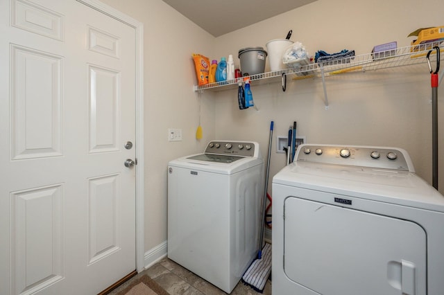 laundry room featuring washing machine and clothes dryer