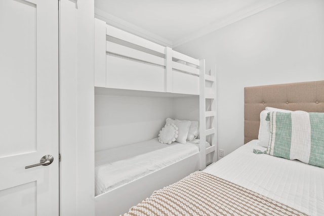 bedroom featuring crown molding