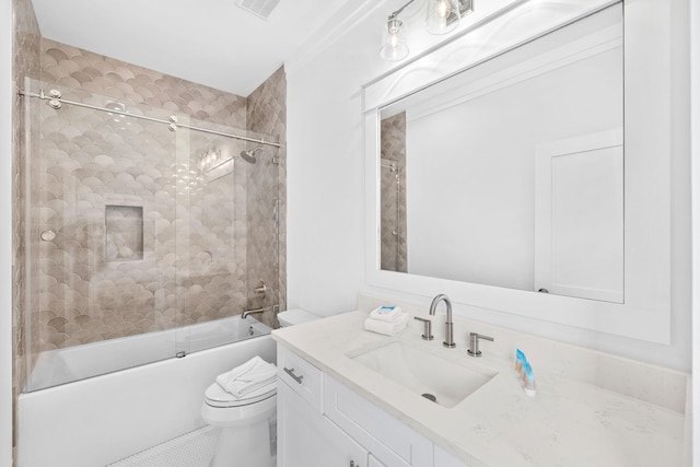 full bathroom featuring tile patterned flooring, enclosed tub / shower combo, toilet, and vanity