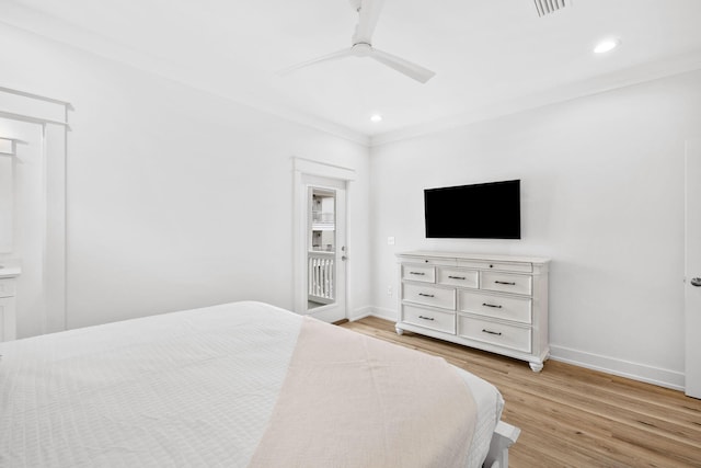 bedroom with ceiling fan, light wood-type flooring, and ornamental molding