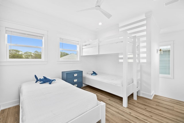 bedroom with wood-type flooring and ceiling fan