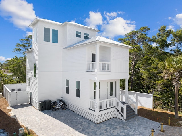 view of front of home featuring a balcony