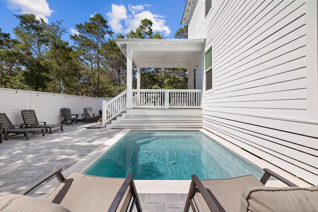 view of pool featuring a patio area