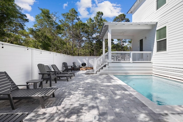 view of swimming pool with a patio