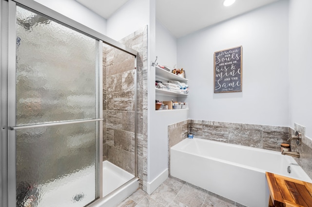 bathroom with shower with separate bathtub